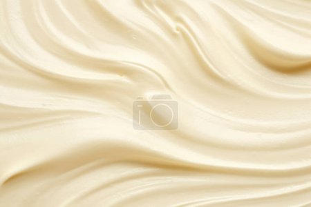 Textura de crema de oro puro fondo de producto cosmético cremoso suave, textura de crema de espuma blanca para el telón de fondo.