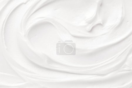 Foto de Puro rosa piel blanca cuidado textura suave cremoso producto cosmético fondo, blanco lujoso deleite de cuidado de la piel con una delicada textura crema para el telón de fondo. - Imagen libre de derechos