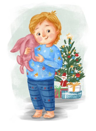Foto de Lindo chico con conejito juguete y árbol de Navidad - Imagen libre de derechos