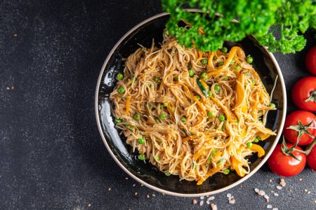 Photo for Rice noodles with vegetables Asian dish fresh delicious snack healthy meal food snack diet on the table copy space food background rustic top view keto or paleo diet veggie vegan or vegetarian food - Royalty Free Image