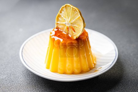flan sweet dessert cream, caramel, lemon healthy meal food snack on the table copy space food background rustic top view
