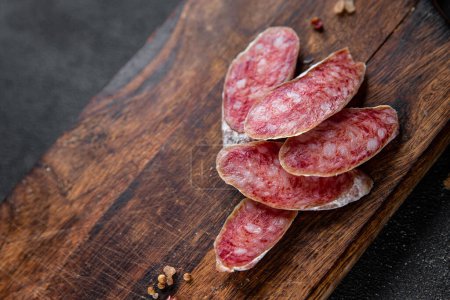 Photo for Fuet sausage cured spanish meat product meal food snack on the table copy space food background rustic top view - Royalty Free Image