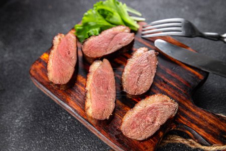 Photo for Duck breast roasted second course fresh poultry meat meal food snack on the table copy space food background rustic top view - Royalty Free Image