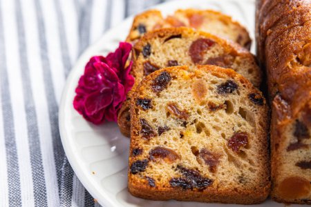 fruit cake sweet dessert dried fruit traditional pastry, nuts meal food snack on the table copy space food background rustic top view