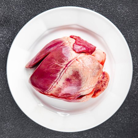 heart raw offal pork or beef healthy meal food snack on the table copy space food background rustic top view keto or paleo diet
