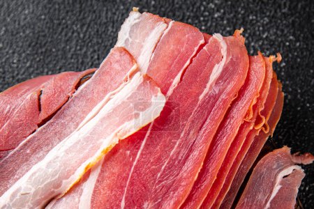 bacon strips slice smoked lard meat meal food snack on the table copy space food background rustic top view