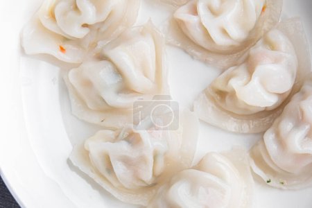 Knödel Dim Sum Reismehl Teig chinesisches Essen Mahlzeit Snack auf dem Tisch kopieren Raum Lebensmittel Hintergrund rustikal Draufsicht