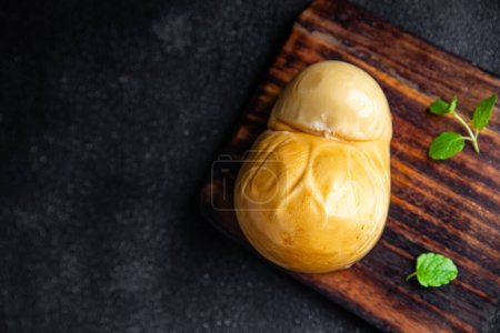 Photo for Fresh cheese scamorza smoked flavor food snack on the table copy space food background rustic top view - Royalty Free Image