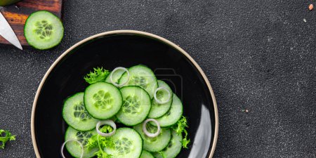 Photo for Cucumber salad fresh vegetable healthy meal food snack on the table copy space food background rustic top view keto or paleo diet veggie vegan or vegetarian food - Royalty Free Image