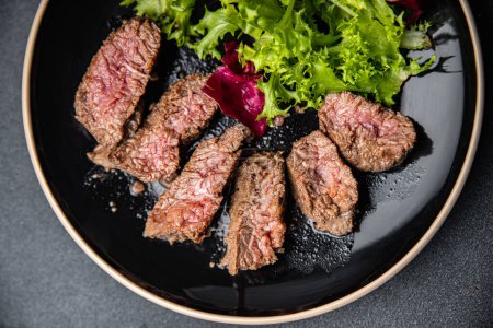 beef steak rare fried piece of meat roasting healthy meal food snack on the table copy space food background rustic top view keto or paleo diet