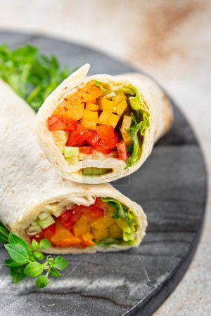 Photo for Tortilla vegetable tacos vegetarian vegan food burrito fajita shawarma with vegetables pita healthy meal food snack on the table copy space food background rustic top view - Royalty Free Image