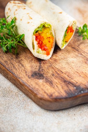 Photo for Tortilla vegetable tacos vegetarian vegan food burrito fajita shawarma with vegetables pita healthy meal food snack on the table copy space food background rustic top view - Royalty Free Image