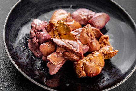 chicken liver confit boiled chicken offal meat meal food snack on the table copy space food background rustic top view keto or paleo diet