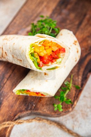 Photo for Tortilla wrap vegetable tacos vegetarian food burrito veganfajita shawarma vegetables pita healthy meal food snack on the table copy space food background rustic top view - Royalty Free Image