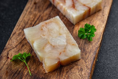 rohe Fischbrikett Filet Meeresfrüchte Auftauen Mahlzeit Lebensmittel Snack auf dem Tisch kopieren Raum Lebensmittel Hintergrund rustikal Draufsicht