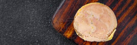 Foto de Foie gras canard block ready to eat cooking appetizer meal food snack on the table copy space food background rustic top view - Imagen libre de derechos