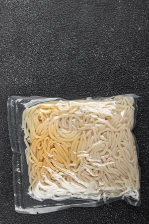 udon packaged noodles japanese cuisine wheat flour tasty fresh healthy eating cooking appetizer meal food snack on the table copy space food background rustic top view