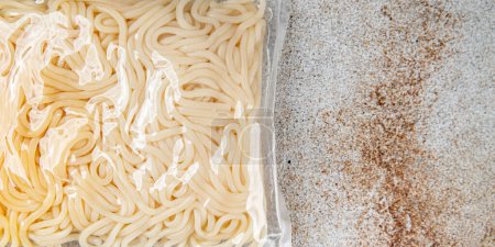 udon packaged noodles japanese cuisine wheat flour tasty fresh healthy eating cooking appetizer meal food snack on the table copy space food background rustic top view