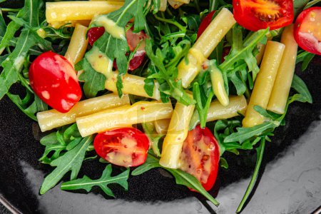 pasta salad tomato, arugula fresh food tasty eating cooking appetizer meal food snack on the table copy space food background rustic top view