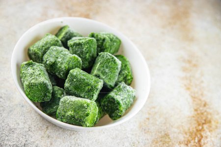 frozen spinach portion cube semifinished fresh food tasty healthy eating cooking meal snack on the table copy space food background rustic 