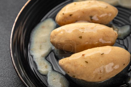 quenelles pork sauce mushroom food on a plate eating cooking appetizer meal food snack on the table copy space food background