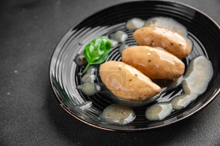 quenelles pork sauce mushroom food on a plate eating cooking appetizer meal food snack on the table copy space food background