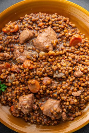 lentils with meat beef or pork fresh cooking appetizer meal food snack on the table copy space food background rustic top view keto or paleo diet
