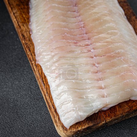 raw white fish fillet giant sea bass and filleting grouper fresh cooking appetizer meal food snack on the table copy space food background rustic top view Pescetarian diet vegetarian food