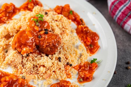 couscous with meat balls vegetable sauce tasty fresh meal food snack on the table copy space food background rustic top view keto or paleo diet