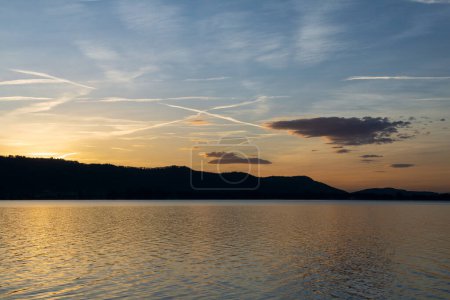 Photo for Contrails in the sky Lake Constance sunset - Royalty Free Image