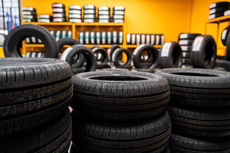 Photo for Lots of New tires, Car tires at warehouse. Car tires, Automobile industry. - Royalty Free Image