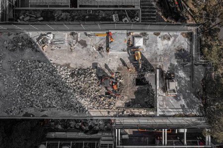 Photo for Aerial drone photo of demolition site and construction workers using heavy machinery - Royalty Free Image