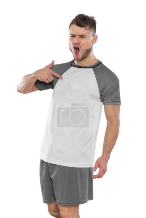 Photo for Professional soccer player with a Poland national team jersey shouting with excitement for scoring a goal with an expression of challenge and happiness on a white background. - Royalty Free Image