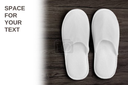 Photo for Spa, hotel - home slippers on wooden background with white space for text - Royalty Free Image