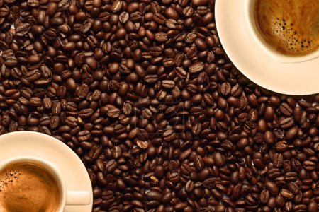 Photo for Black coffee in cups on roasted coffee beans background - Royalty Free Image