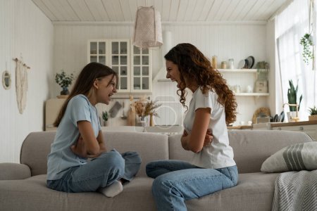 Photo for Angry young woman mother having disagreement with troubled teen girl, disrespectful child daughter arguing quarreling with mom at home. Conflict between parents and teenagers, problems of adolescence - Royalty Free Image