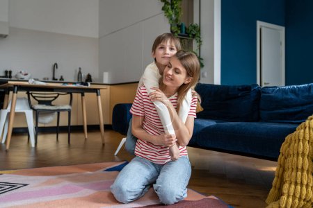 Photo for Mother and preteen son have good time together, play home in living room on floor. Good relationship between children and parents. Love of single mom for son. Happy childhood - Royalty Free Image