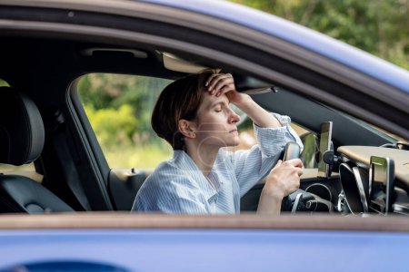 Photo for Tired woman stopped after driving car. Pensive sad middle aged female thinking about life troubles, has relationship problems. Depressed vehicle driver in automobile feeling bad. Burnout, exhaustion - Royalty Free Image