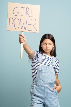 Photo for Teenage girl holds banner girl power. Picketing, fighting for womens rights, feminism, getting rid of prejudices and stereotypes about female. Young woman protest against misogynistic society - Royalty Free Image