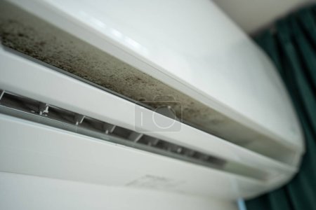 Photo for Mold in air conditioner, untimely cleaning late maintenance in humid climate. Dirt, dust, pathogenic viruses and microbes inside air conditioner. Health hazards, risks of dangerous mould concept. - Royalty Free Image