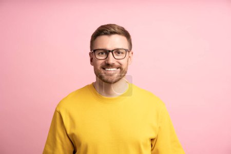Photo for Pleased man with glasses smiling, studio portrait. Educated guy smart professional looks at camera with joyful emotions on face. Promising student prepare for bright future with good job stable income - Royalty Free Image