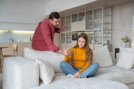 Home dispute couple engulfed in heated argument, tumultuous relationship with resentment, frustration. Angry man have quarrel dispute with offended woman in atmosphere charged with negative emotions.