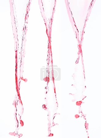 Photo for Red juice from splash in Air. Water red tomato pour from sky and purify clean natural. Wine shape form of water splashing flow celebrate over White background Isolated - Royalty Free Image