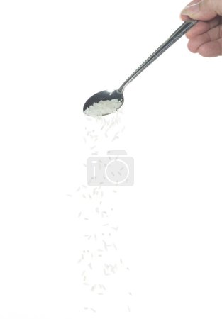 Photo for Japanese Rice fall, white grain rices pouring down abstract cloud fly from spoon. Beautiful complete seed rice in air, food object design. Selective focus freeze shot white background isolated - Royalty Free Image