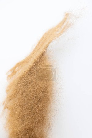 Photo for Sand flying explosion, Golden sand wave explode. Abstract sands cloud fly. Yellow colored sand splash throwing in Air. White background Isolated selective focus, throwing motion Blur - Royalty Free Image