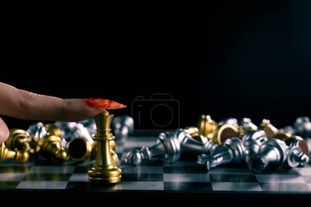 Photo for Business woman play queen Chess with close up finger nail. Leader use strategy game to challenge competitor with leadership to move Queen to victory with management team idea fight last stand - Royalty Free Image