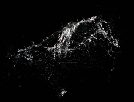 Téléchargez les photos : Shape form throw of Water splashes into drop water attack fluttering in air and stop motion freeze shot. Splash Water for explosion texture graphic resource elements, black background isolated - en image libre de droit