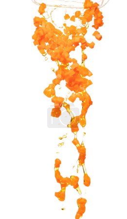 Téléchargez les photos : Carrot fresh dice cube shape pouring down with water. Beta Carotene orange color in Carrot is good health. Many Dice cube carrot falling with cooking oil. White background isolated, high speed - en image libre de droit