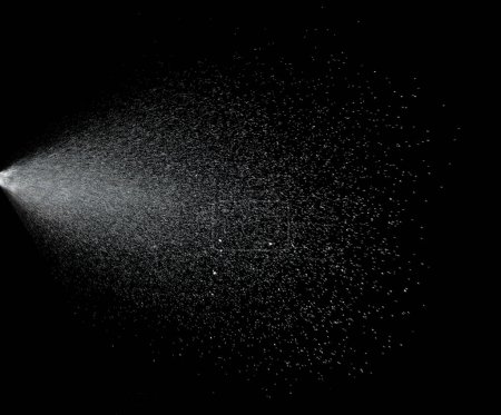 Téléchargez les photos : Million of Star Dust, Photo image of falling down shower rain snow, heavy snows storm flying. Freeze shot on black background isolated overlay. Spray water fog smoke as star particle on wind - en image libre de droit