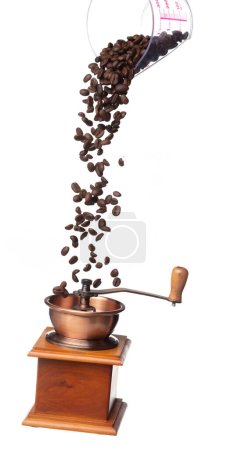 Photo for Coffee Grinder fly float in air, vintage Coffee mill for coffee bean to crush into ground powder over White background Isolated high speed shutter, freeze motion - Royalty Free Image